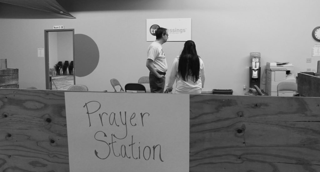 The prayer station at Delaware City Vineyard is an optional component of their FEED event. Members of the church offer prayers and support to anyone who wishes to receive it. 