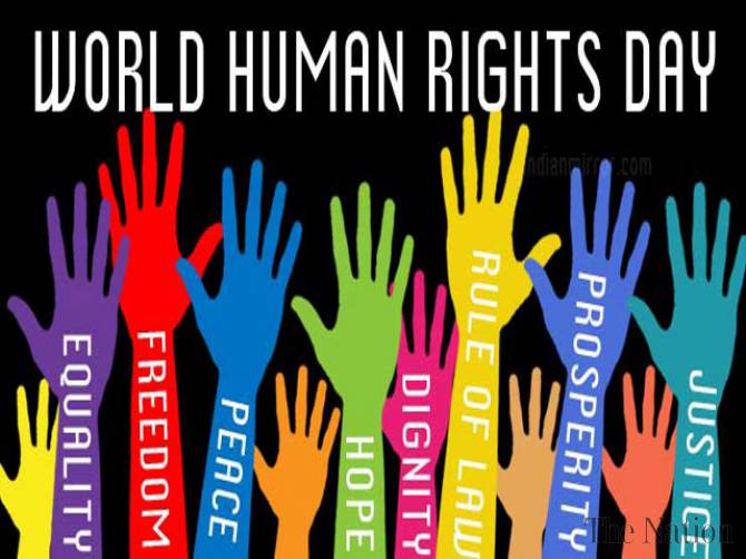 hands held high for Human Rights Day