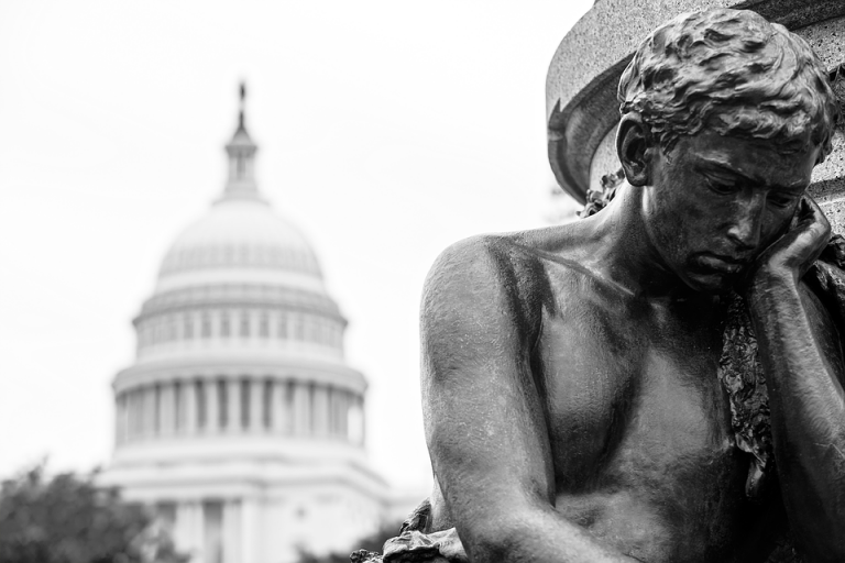 Statue crying in front of Capitol building